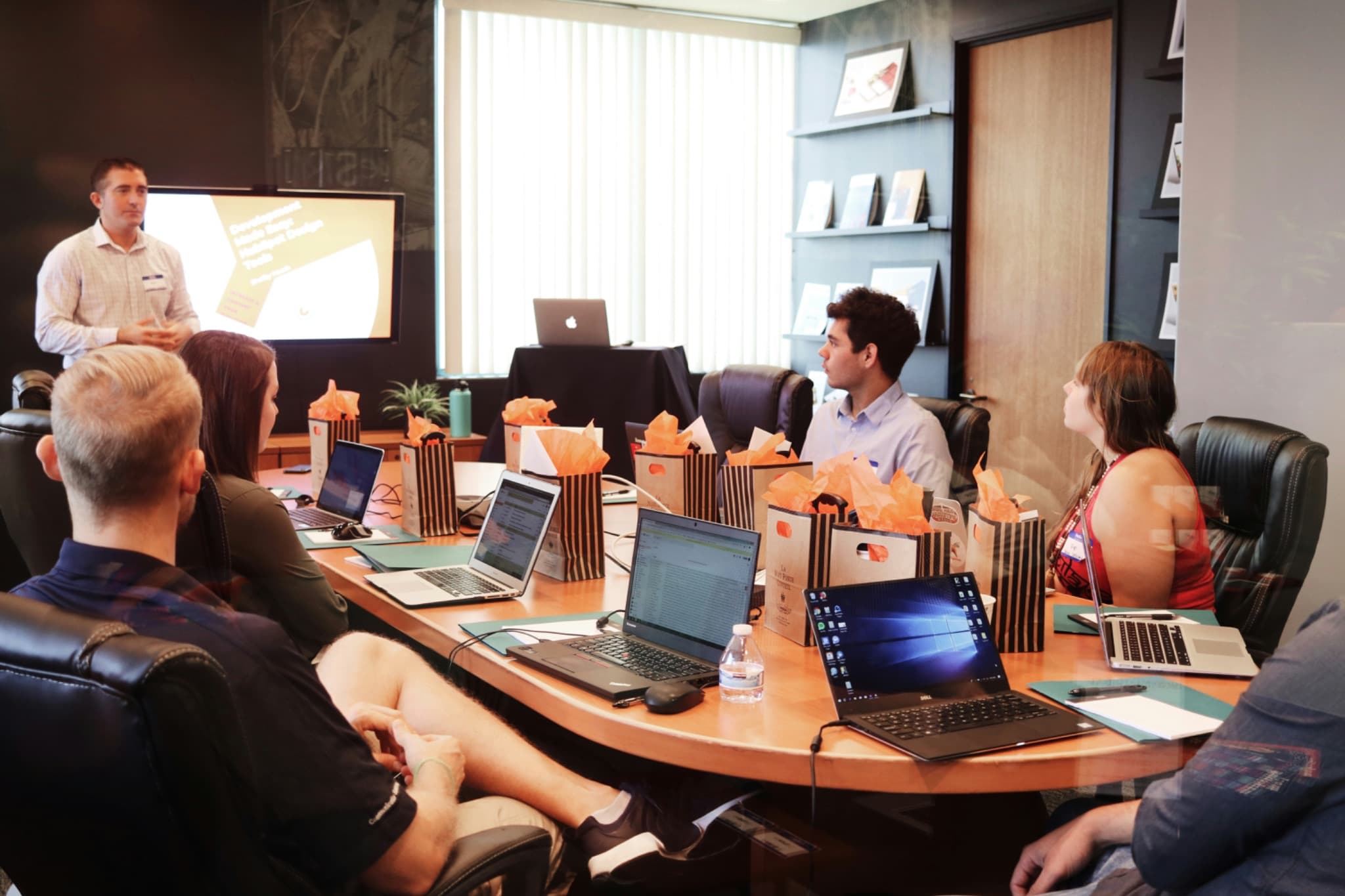 Workshop or event with laptops and presentation